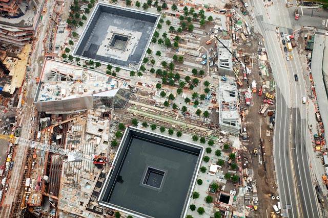 Looking down at the 9/11 Memorial from the top of 1 WTC.